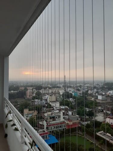 Invisible Grills Installation and Service in Lucknow by Khidki Kraft - High-quality stainless steel wires that provide unmatched safety without compromising your view.